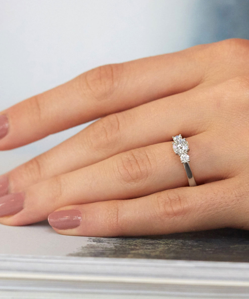 0.70ct Round Cut Platinum Three Stone Engagement Ring Modelled